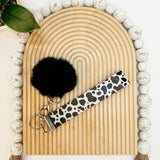 It's a Moo'd Leather Keychain
